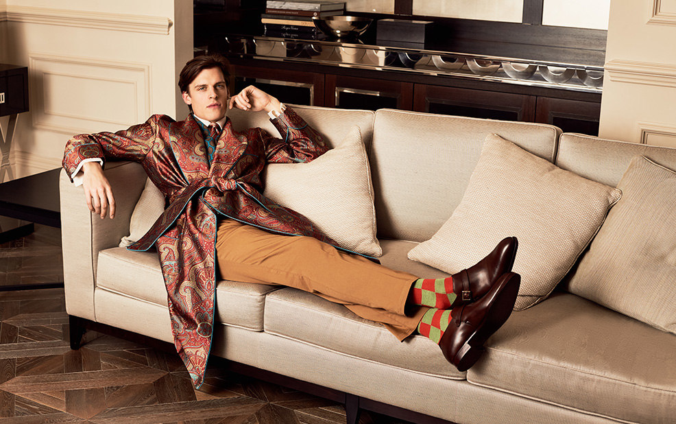 man in silk red dressing gown on tan couch – New & Lingwood – point one percent