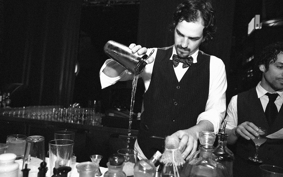 bartender pouring cocktail in black and white – Purity Vodka – point one percent