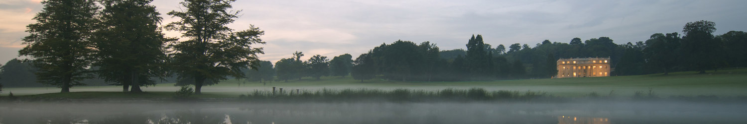 mansion on a lake at dusk – Savills – point one percent