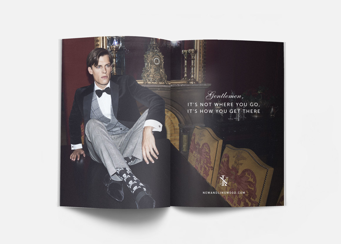 man in suit sitting on table with skull and cross bone socks print ad campaign – New & Lingwood – point one percent